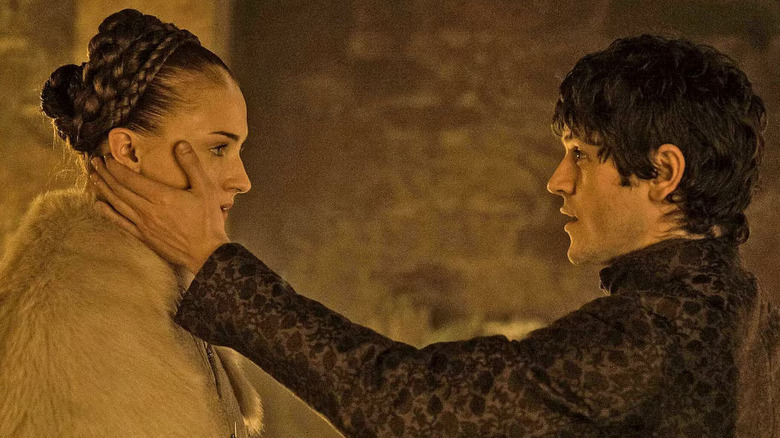 Sophie Turner as Sansa Stark stares as Iwan Rheon as Ramsay Bolton in Game of Thrones