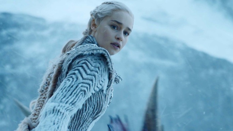 Emilia Clarke as Daenarys Targaryan looks over her shoulder in Game of Thrones
