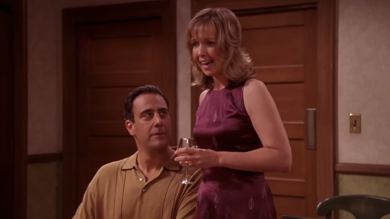 Brad Garrett Robert looks up at Monica Horan as Amy in Everybody Loves Raymond