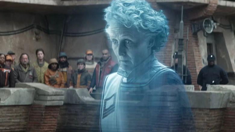 Marva Andor aparece como holograma em seu próprio funeral