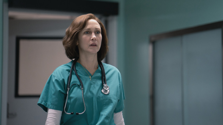Vera Farmiga as Dr. Anna Pou in medical scrubs in Five Days at Memorial