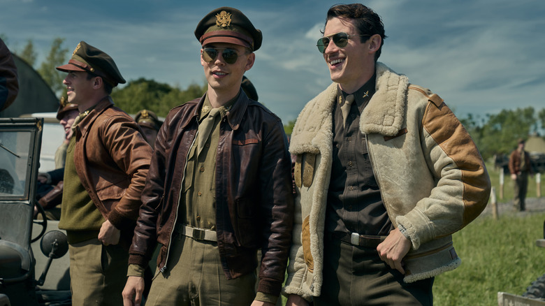 Anthony Boyle, Austin Butler and Callum Turner standing together in pilots gear in Masters of the Air
