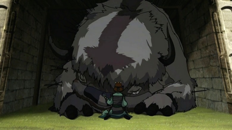 Suki petting a battered Appa on Avatar: The Last Airbender S2E16