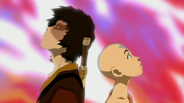 Aang and Zuko staring at colorful dragon fire on Avatar: The Last Airbender