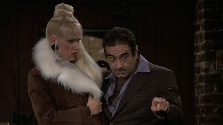 Dan Hedaya's Nick Tortelli stands next to Jean Kasem's Loretta Tortelli on Cheers