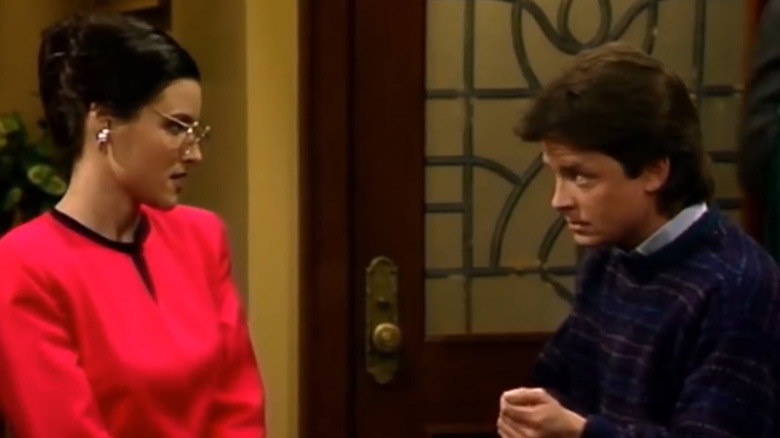 Julia Louis-Dreyfus and Michael J. Fox giving each other the side-eye on Family Ties