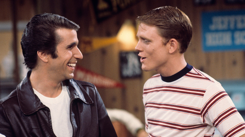 Fonzie and Richie smiling at each other