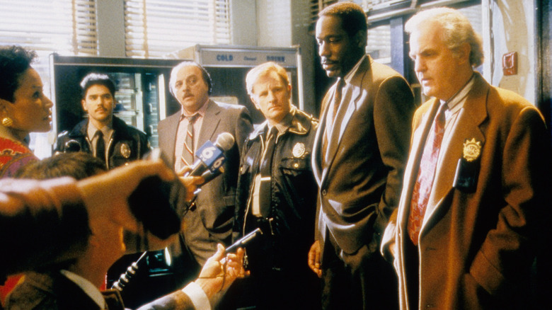 Police officers face questions from media