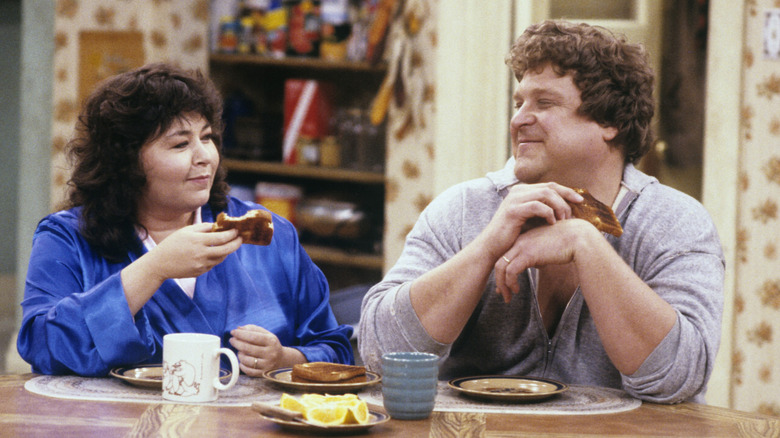 Roseanne and Dan eating toast together