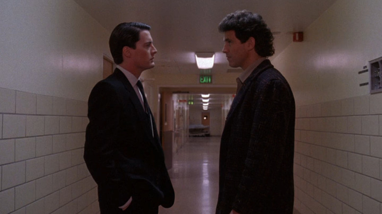 Cooper and the sheriff standing in hallway