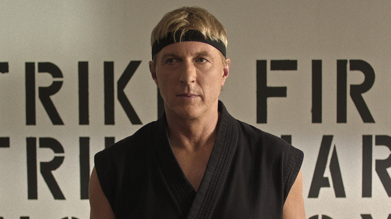 William Zabka as Johnny in black karate outfit in Cobra Kai