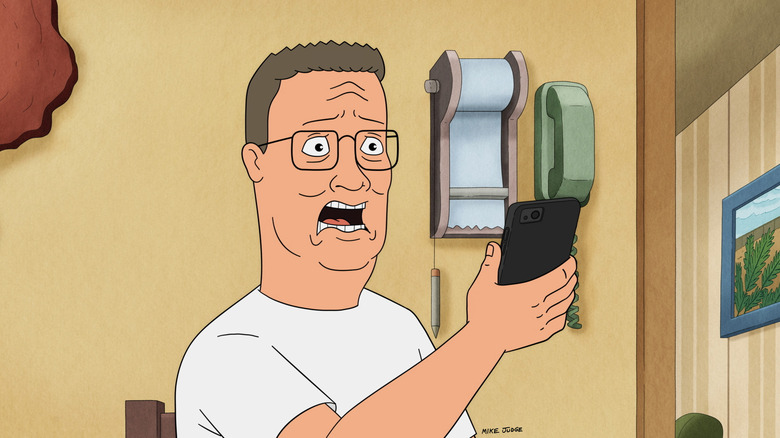 Hank Hill is shocked by something on his phone in King of the Hill