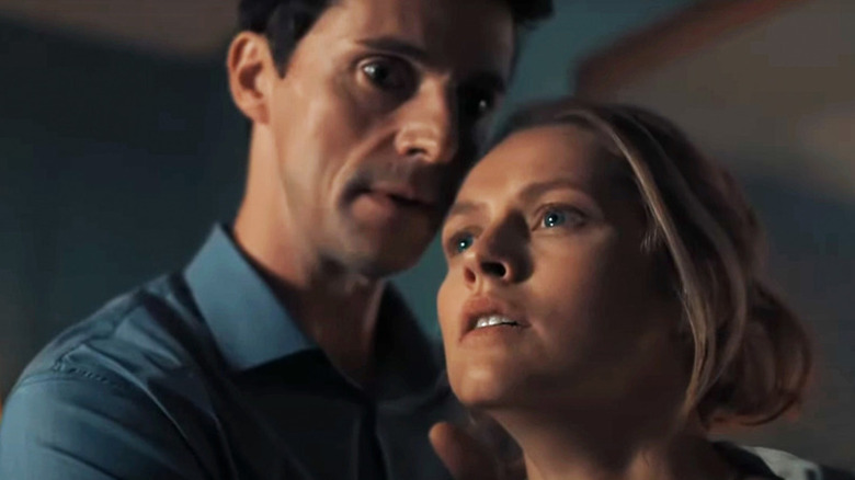 Matthew Clairmont (Matthew Goode) holds a teary-eyed Diana Bishop (Teresa Palmer) in A Discovery of Witches