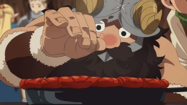 Senshi adds a pinch of seasoning to a skillet in Delicious in Dungeon