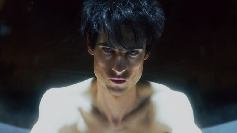 Morpheus (Tom Sturridge) sits naked in a cell in The Sandman