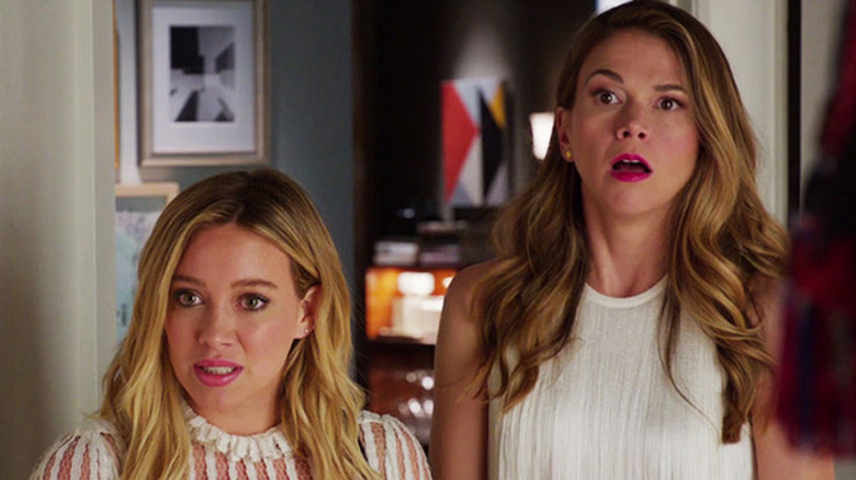 Sutton Foster as Liza looking surprised next to Hilary Duff as Kelsey in Younger