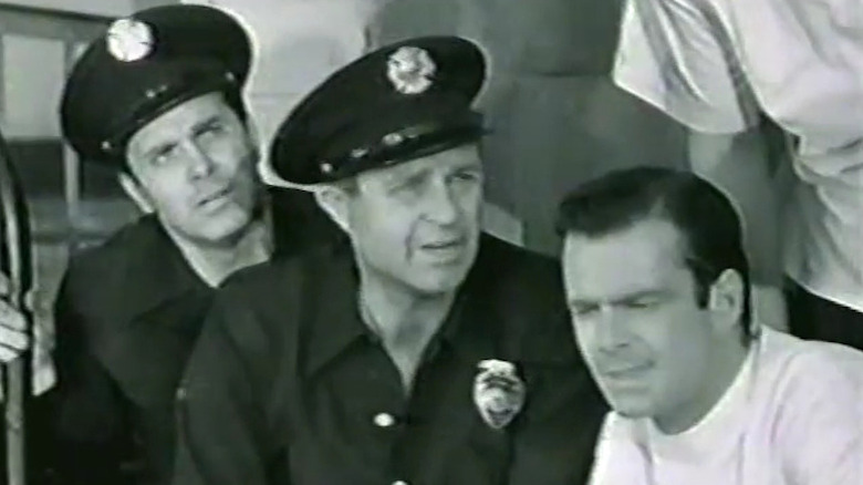 Lang Jeffries as Skip Johnson and Jim Davis as Was Cameron in dark uniforms in Rescue 8