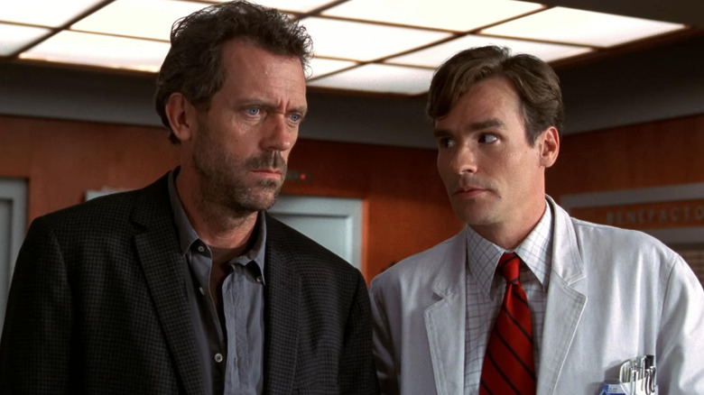Dr. House (Hugh Laurie) and Dr. Wilson (Robert Sean Leonard) examine a patient in House