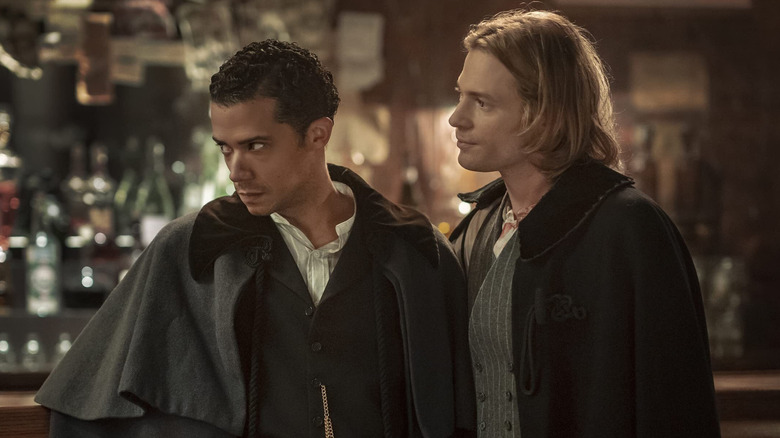 Louis and Lestat stare at someone at a bar