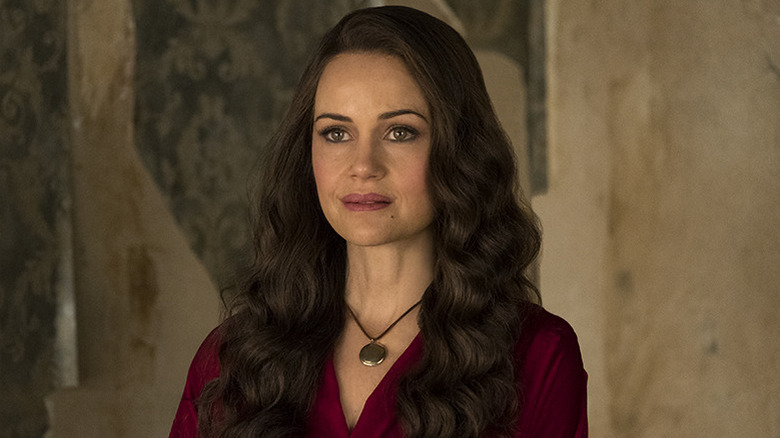 Olivia Crain staring placidly in The Haunting of Hill House