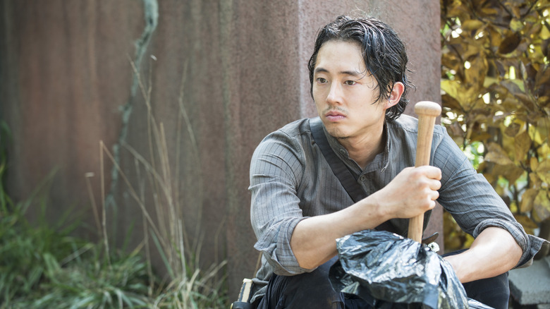 Glenn holding baseball bat