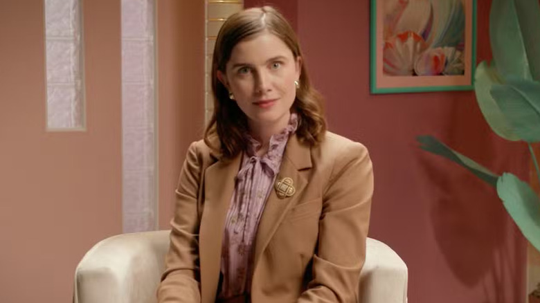 Vic Michaelis sitting in a chair staring at the camera in Very Important People