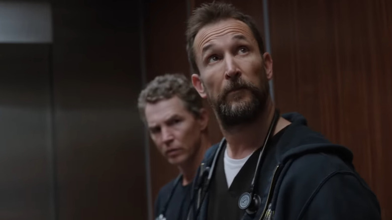 Noah Wyle as Dr. Michael "Robby" Robinavitch looks up in The Pitt