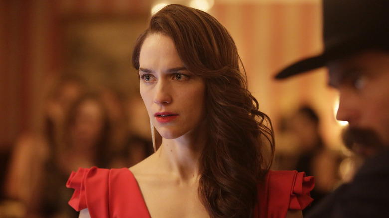 Wynonna Earp (Melanie Scrofano) wearing a red dress in Wynonna Earp