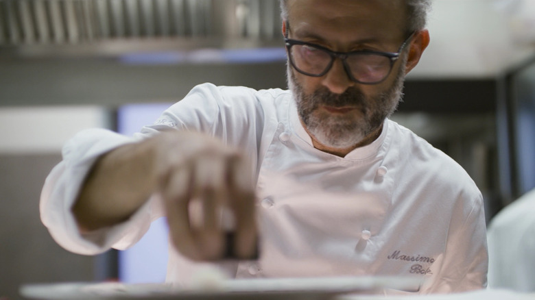 Massimo Bottura plates a dish in Chef's Table.