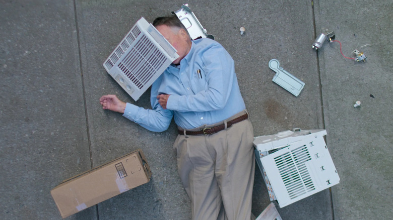 Dick Johnson pretends to be hit by an AC unit in Dick Johnson is Dead.