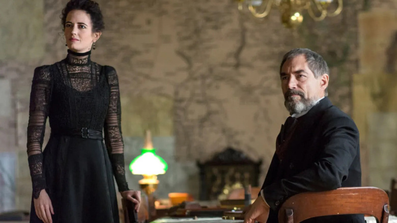 Vanessa Ives and Sir Malcolm Murray transfixed by something out of the shot in Penny Dreadful