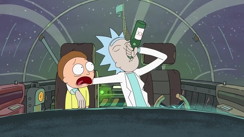 Morty Smith (Justin Roiland) looks shocked as Rick Sanchez (Roiland) drinks in a spaceship cockpit in Rick and Morty