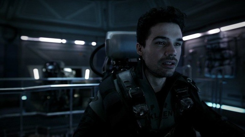 James Holden (Sonny Strait) sits shocked in a pilot seat in The Expanse