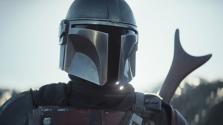 Din Djarin (Pedro Pascal) stands looking into the horizon in The Mandalorian