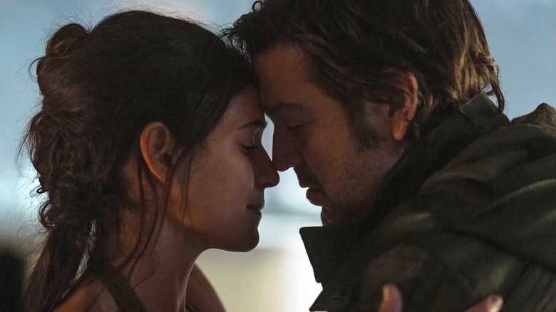 Adria Arjona and Diego Luna as Bix and Andor pressing their foreheads together in Andor