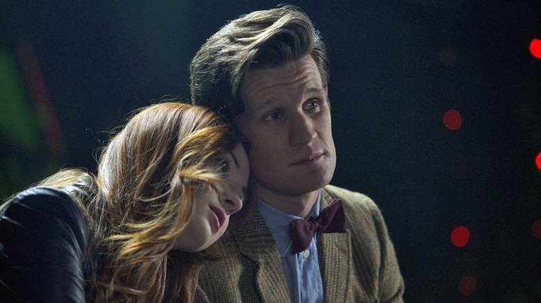 Karen Gillan as Amy resting her head on Matt Smith as the Eleventh Doctor's shoulder in Doctor Who