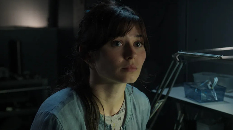 Ruby Cruz as Lily sitting at a desk in For All Mankind