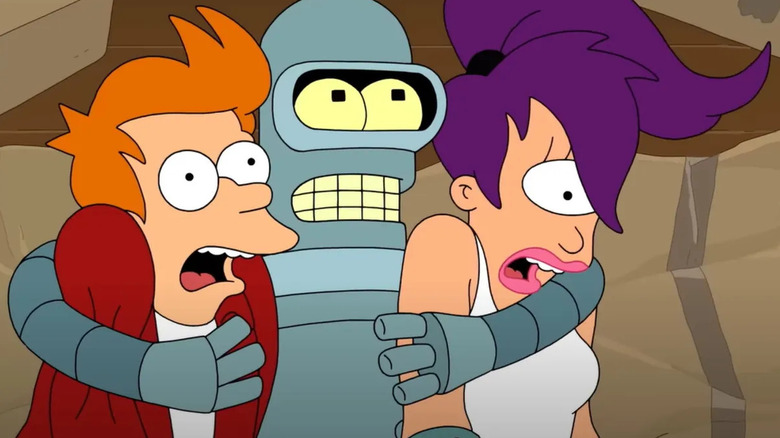 Bender holding onto a scared Philip and Turanga in Futurama