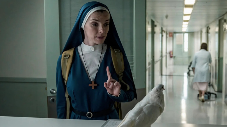 Betty Gilpin as Sister Simone talking to a dove in a hospital in Mrs. Davis