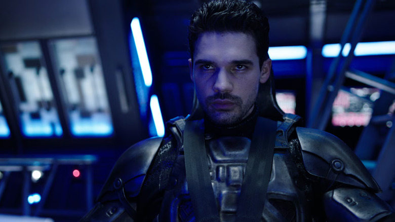 Steven Strait as James looking coldly in a seat in The Expanse