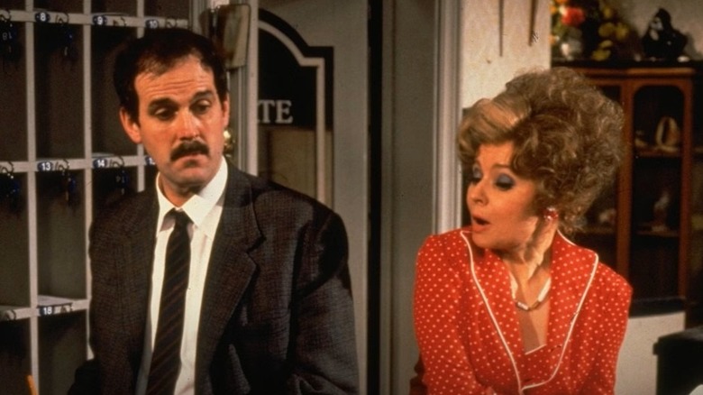 John Cleese as Basil Fawlty gets worn down by wife Sybil, played by Prunella Scales, on Fawlty Towers.