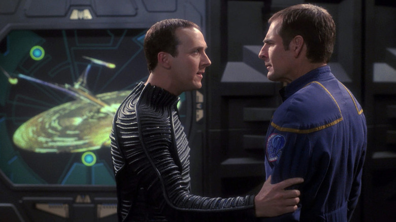 Daniels (Winston) grabs the arm of Jonathan Archer (Scott Bakula) in Star Trek: Enterprise