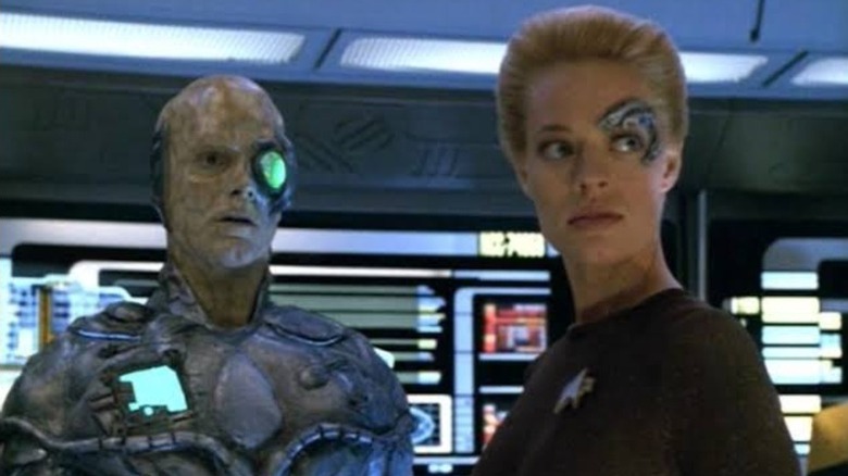 J. Paul Boehmer's One and Jeri Ryan's Seven of Nine looking worried on Star Trek: Voyager