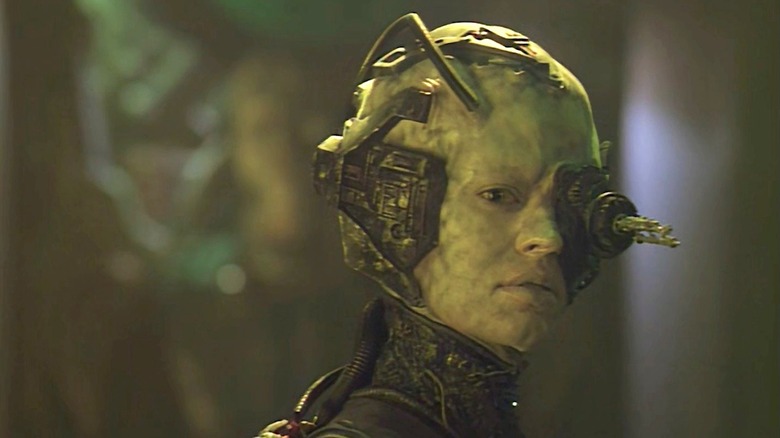 Seven of Nine (Jeri Ryan) stands with her Borg cybernetics in Star Trek: Voyager