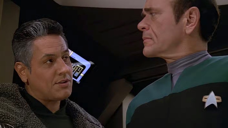Robert Picardo's Doctor and Garrett Wang's Harry Kim looking concerned on Star Trek: Voyager