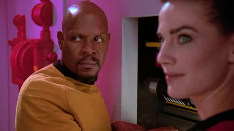 Avery Brooks' Benjamin Sisko and Terry Farrell's Jadzia Dax looking thoughtful on Star Trek: Deep Space Nine