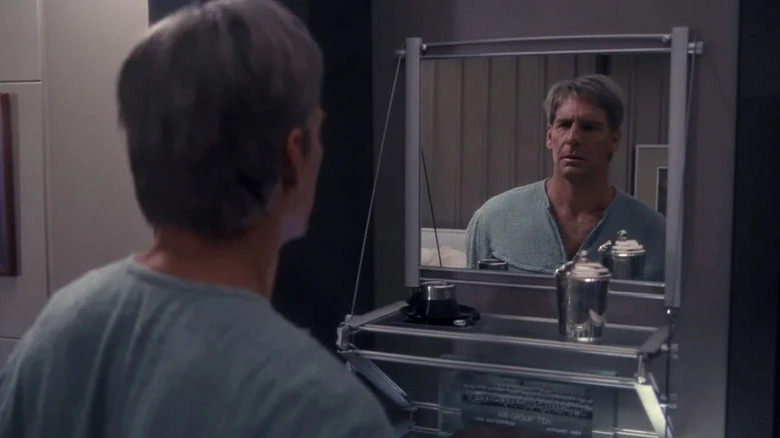 Scott Bakula's Jonathan Archer looking in the mirror on Star Trek: Enterprise