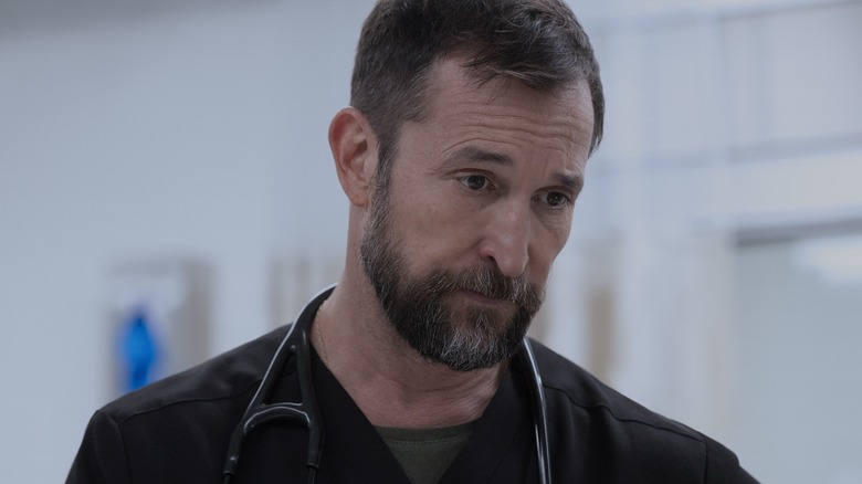 Dr. Michael "Robby" Robinavitch (Noah Wyle) attends to a patient in The Pitt