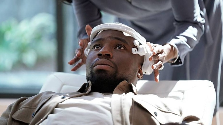 Demascus (Okieriete Onaodowan) gets a VR device affixed to his head in Demascus