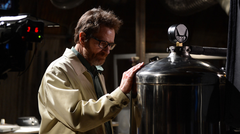 Walter White, reverently touching a large metal canister in Breaking Bad.